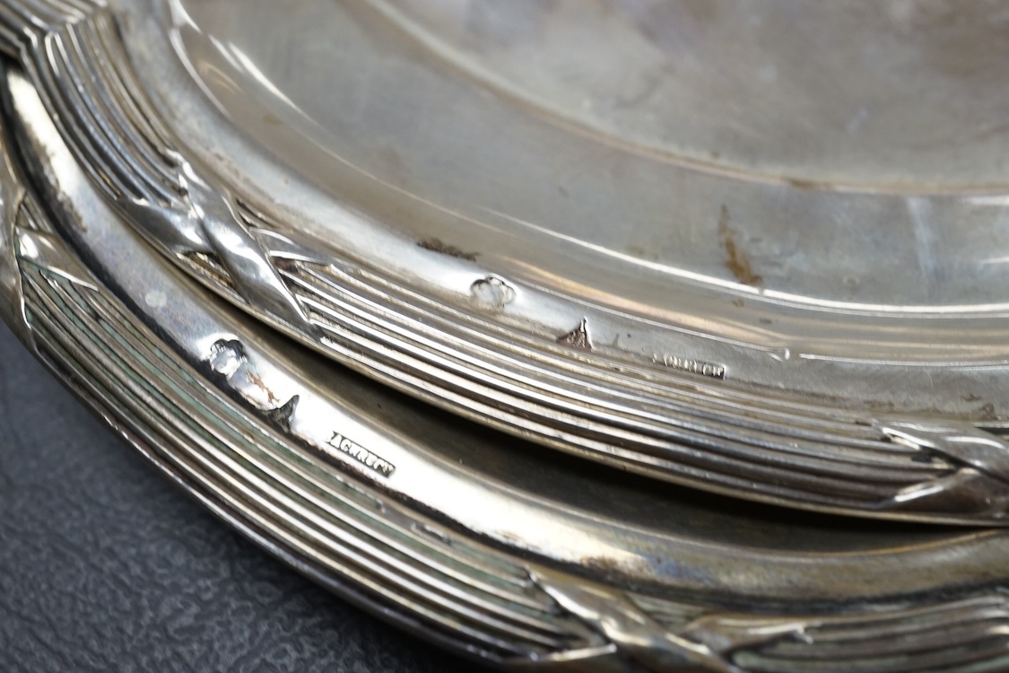 An Italian 800 standard white metal shallow plate with glass insert diameter 30.2cm, together with two Austro-Hungarian 800 standard white metal shaped oval dishes, 40.1oz.